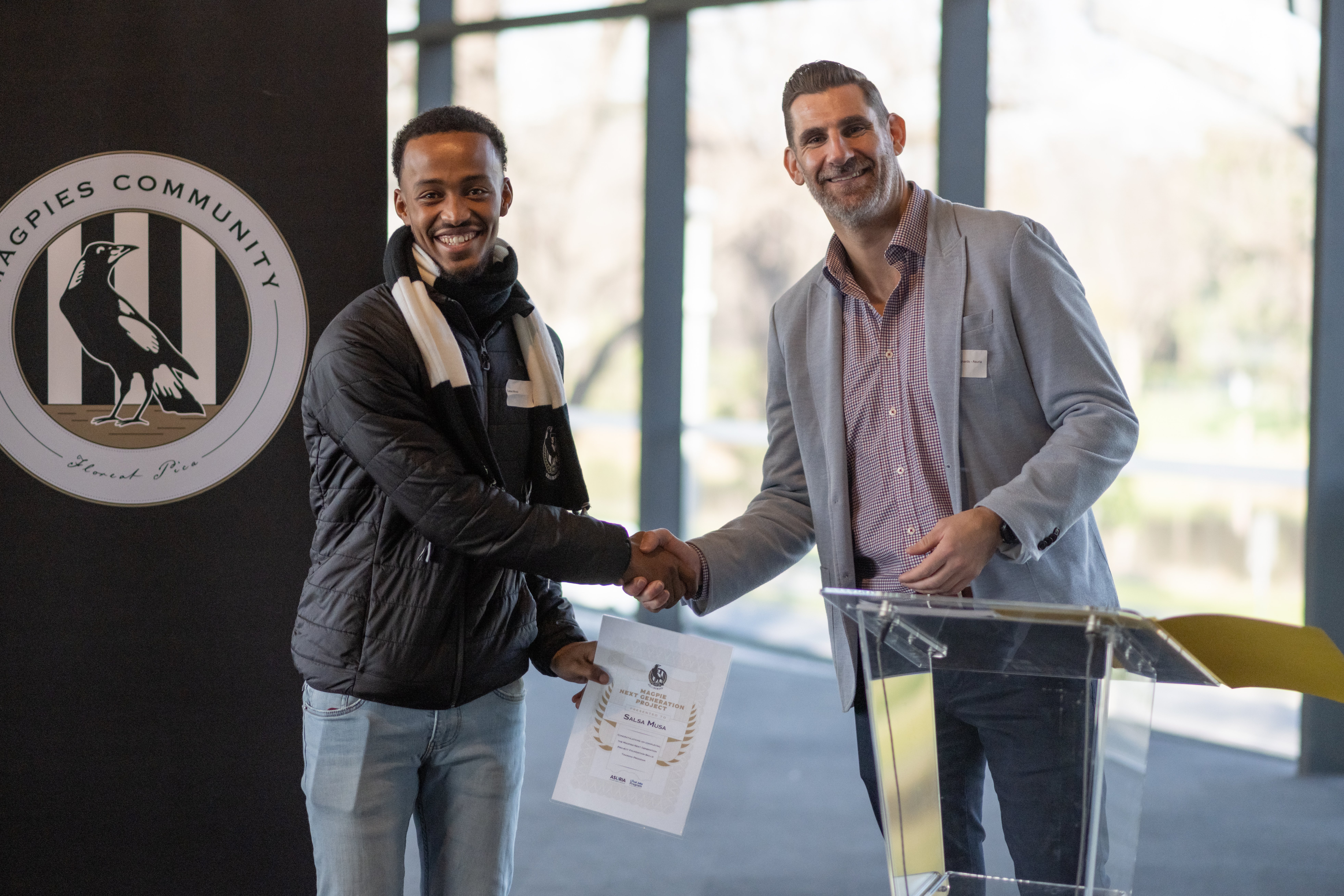 Magpie Next Generation Participant Salas receiving his certificate while shaking hands with Asuria JVES Project Manager Darren Richards