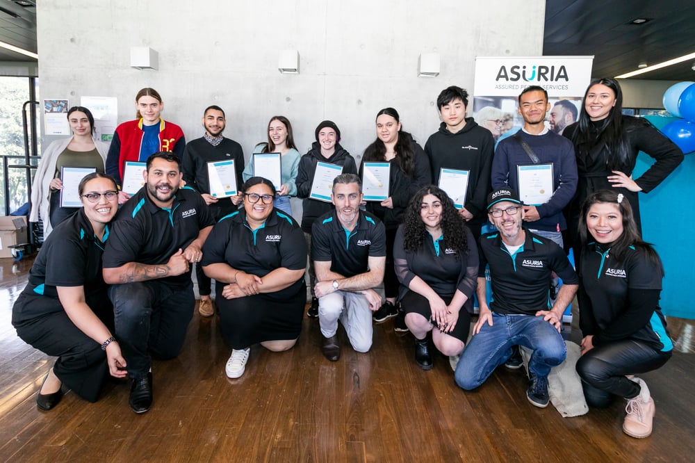 Asuria TTW staff and job seekers holding their certificates