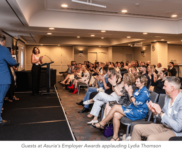 Guests applauding with caption