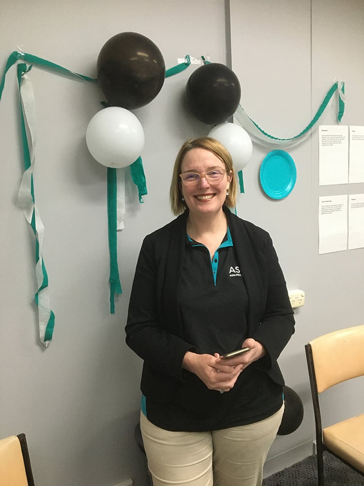Enterprising Heart Chairman’s Award winner for 2021 Sharon Phayer smiling in her asuria uniform on Asuria U day